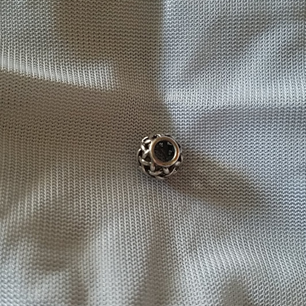 Pandora sterling silver charm.